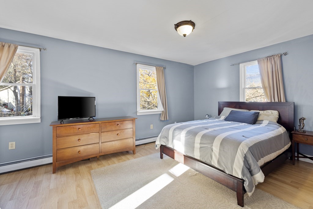 4 Bennett Road Marblehead, MA 01945 - Photo 10 of 19 a bedroom with a bed and a flat screen tv