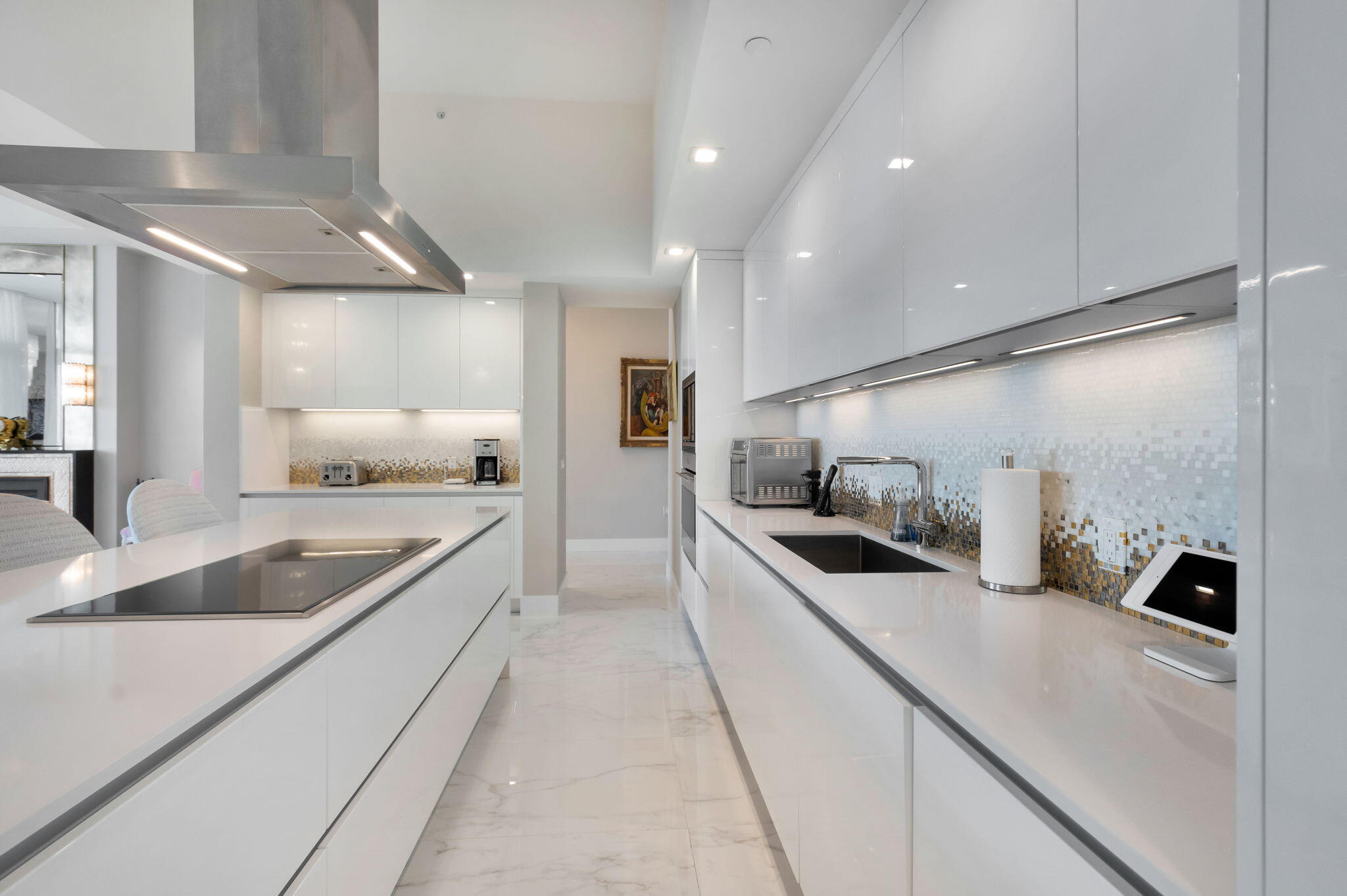 20155 Boca W Drive, Unit PHC902 Boca Raton, FL 33434 - Photo 11 of 56 a kitchen with stainless steel appliances granite countertop a sink and a refrigerator