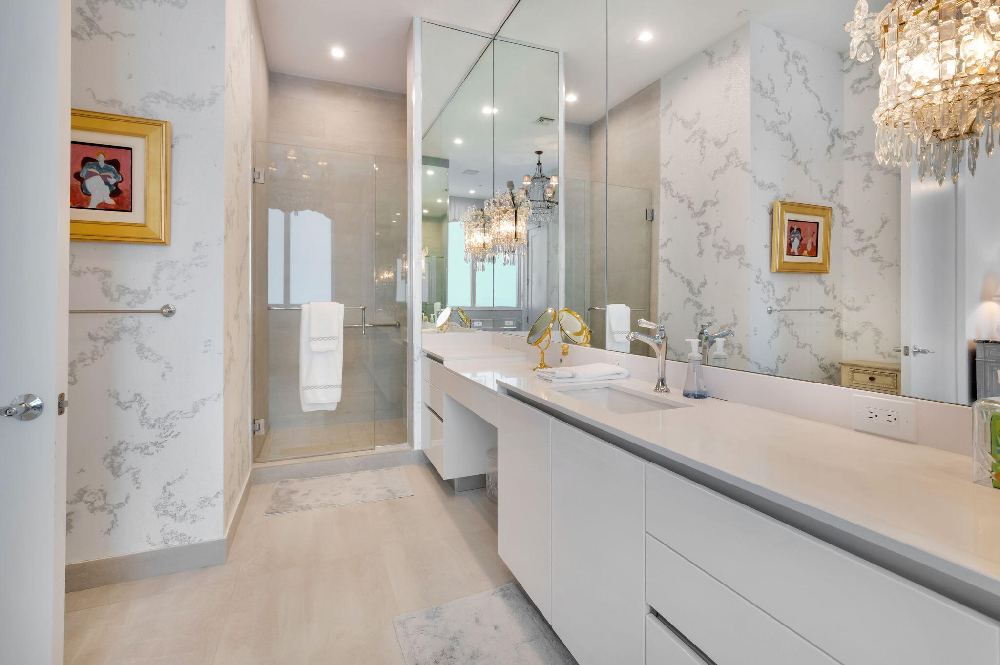 20155 Boca W Drive, Unit PHC902 Boca Raton, FL 33434 - Photo 19 of 56 a bathroom with a double vanity sink mirror and shower