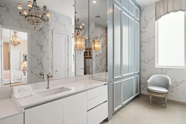 a bathroom with a granite countertop shower a sink and a mirror