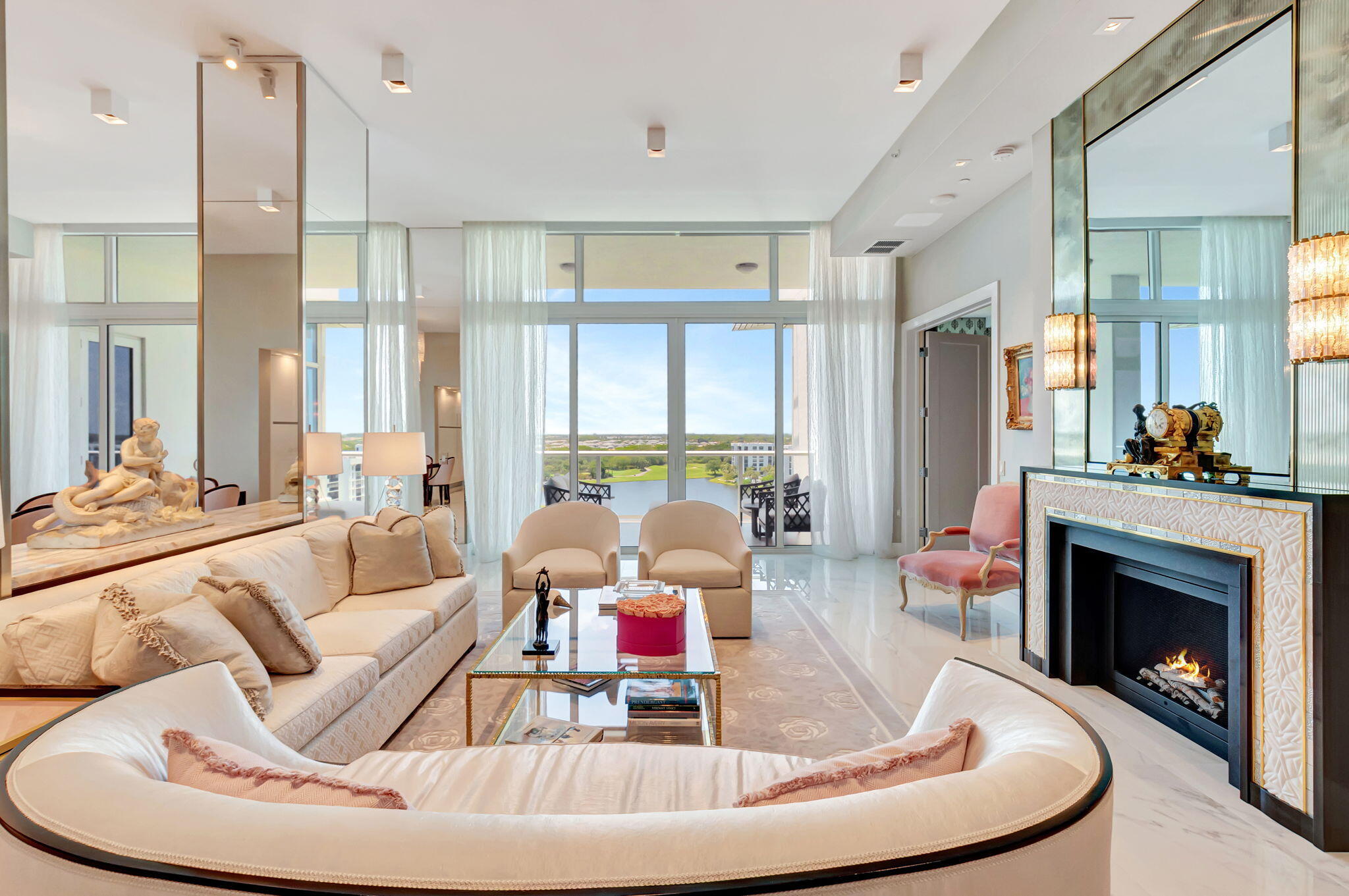 20155 Boca W Drive, Unit PHC902 Boca Raton, FL 33434 - Photo 2 of 56 a living room with furniture and a fireplace