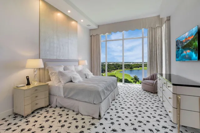 a spacious bathroom with a double vanity sink a mirror and a bathtub