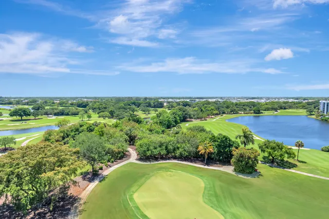 a view of a swimming pool with a yard