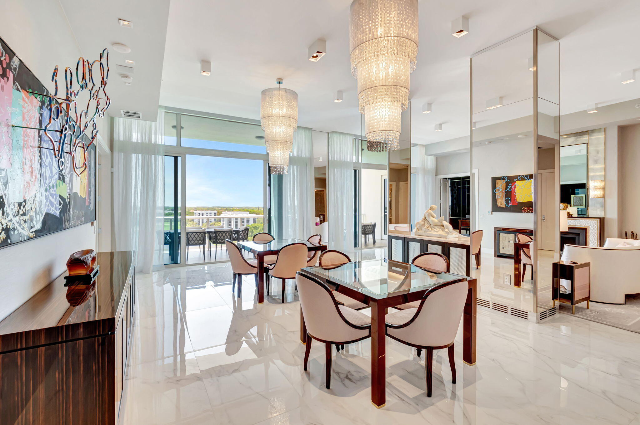 20155 Boca W Drive, Unit PHC902 Boca Raton, FL 33434 - Photo 7 of 56 a dining area with furniture and a chandelier