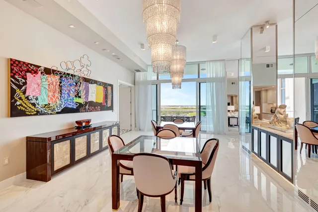 a kitchen with kitchen island a sink stove and white cabinets