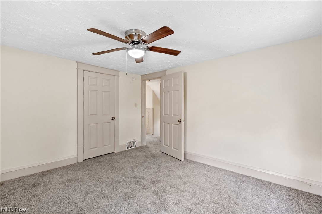 1474 Hampton Road Akron, OH 44305 - Photo 19 of 27 Carpeted bedroom featuring ceiling fan and a textured ceiling