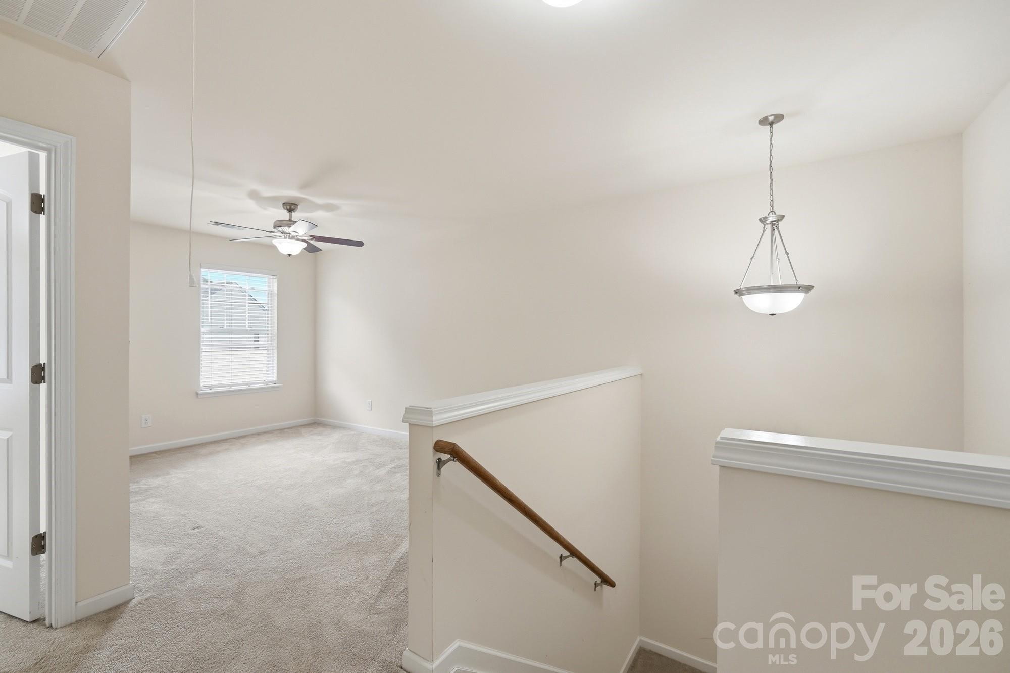 175 Limerick Road, Unit B Mooresville, NC 28115 - Photo 16 of 30 a view of a chandelier in big room with chandelier fan