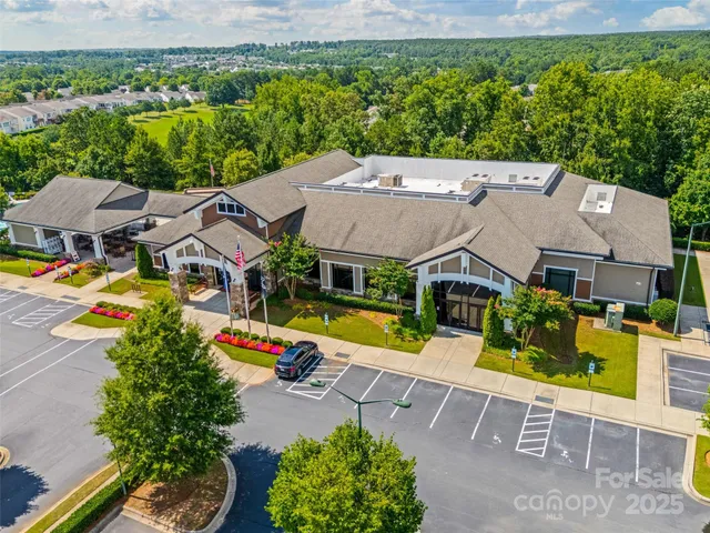 an aerial view of a house with a big yard