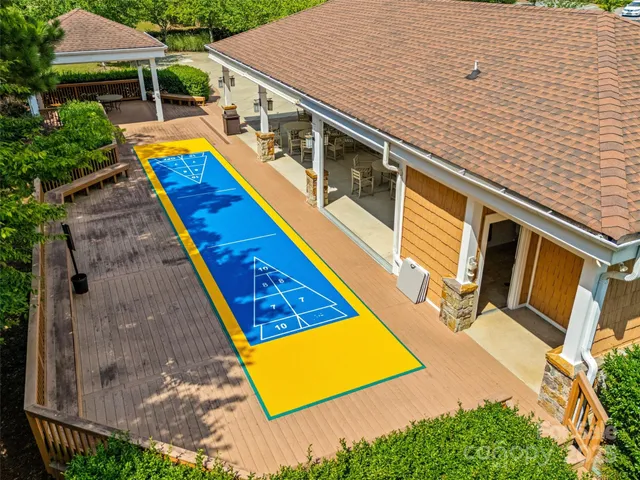 a aerial view of a house with swimming pool