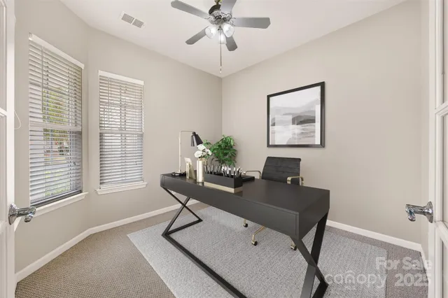 a workspace with furniture and window