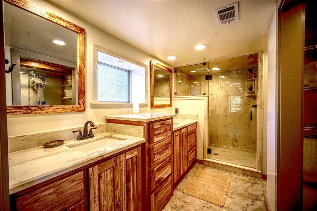 2525 Dodson Pr Road Gordon, TX 76453 - Photo 14 of 31 Full bath featuring a stall shower, two vanities, and recessed lighting