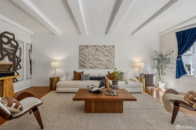 a living room with furniture or couch and a flat screen tv