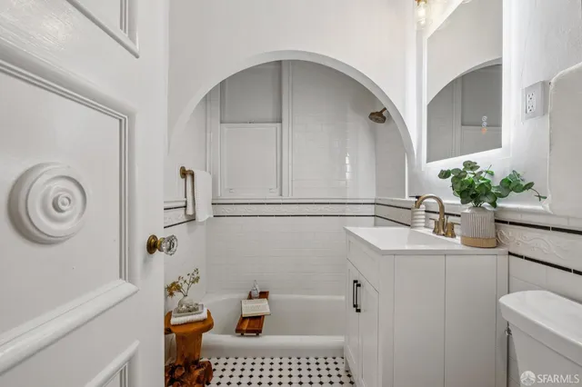 a bathroom with a bathtub and shower