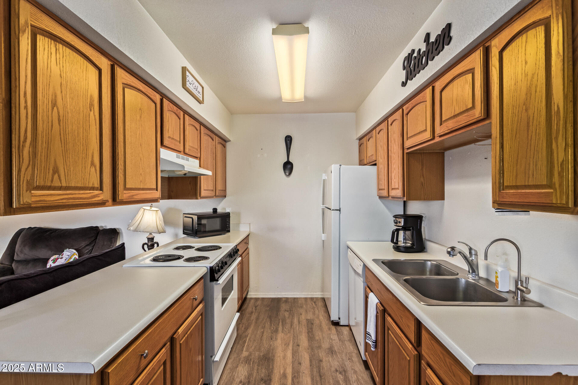 1440 North Idaho Road, Unit 1081 Apache Junction, AZ 85119 - Photo 14 of 33 a kitchen with stainless steel appliances a sink a stove and a refrigerator