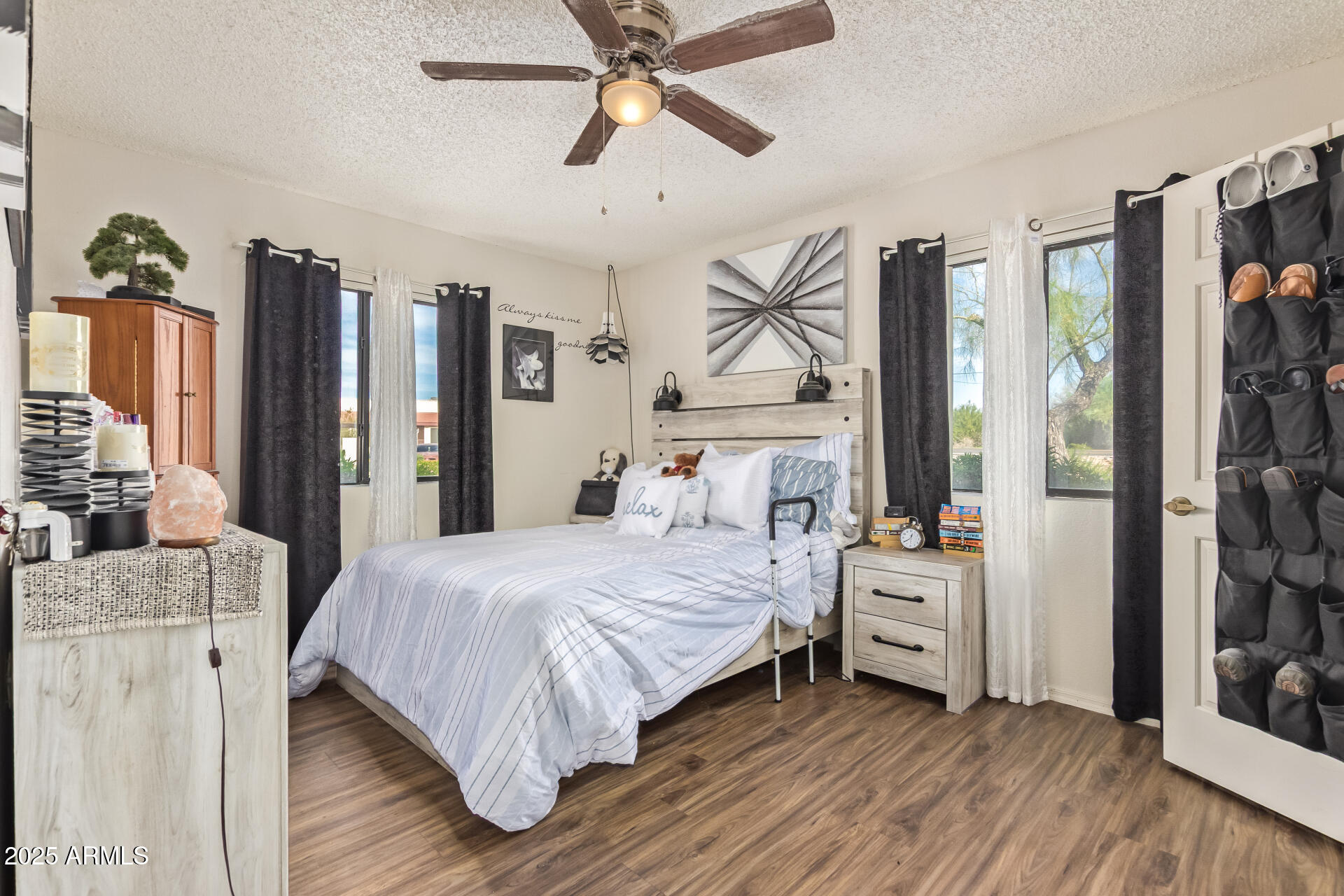 1440 North Idaho Road, Unit 1081 Apache Junction, AZ 85119 - Photo 15 of 33 a bedroom with a bed and a chandelier