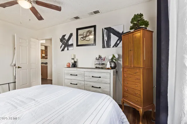 a bedroom with a bed and a dresser