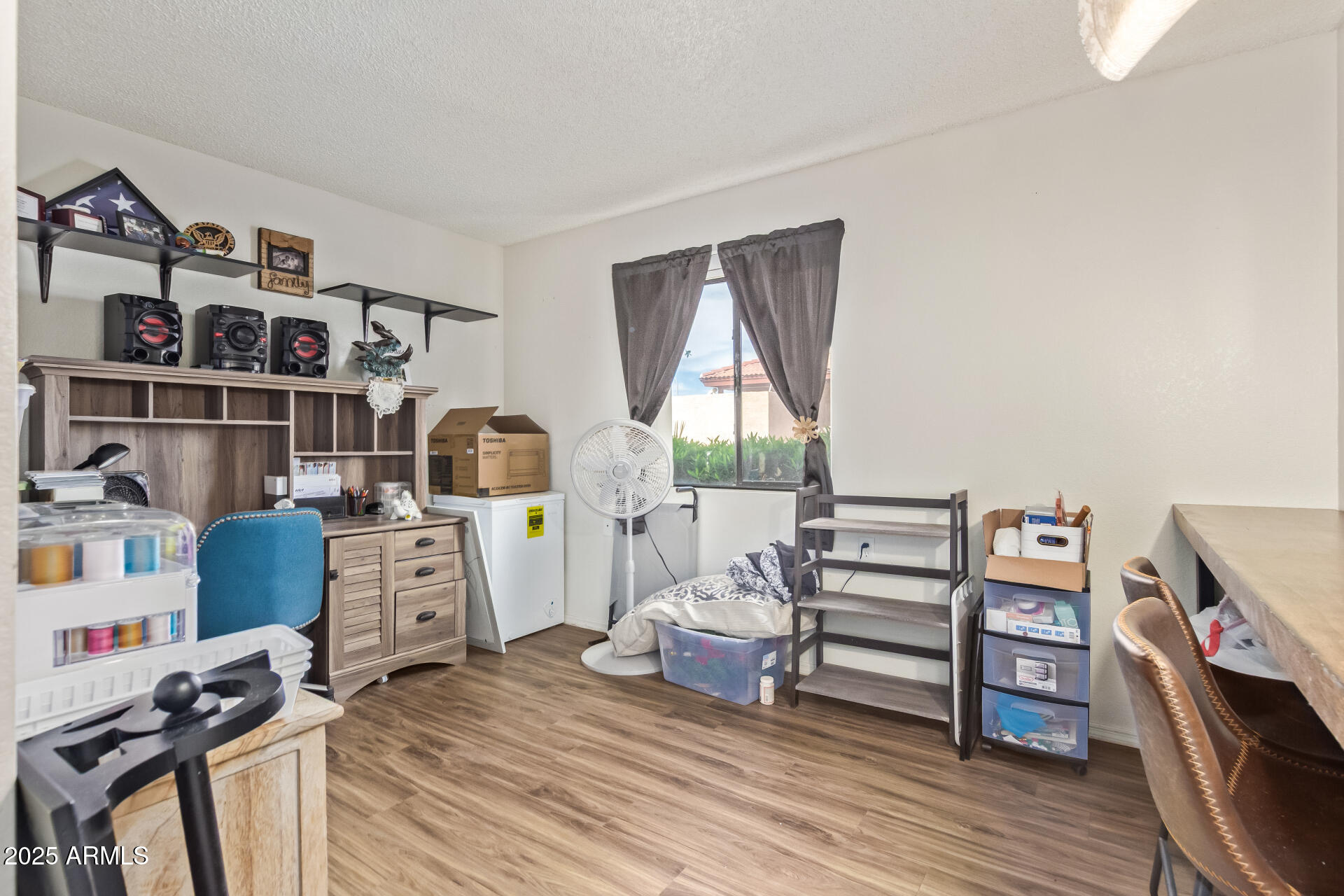 1440 North Idaho Road, Unit 1081 Apache Junction, AZ 85119 - Photo 20 of 33 a view of a workspace with furniture and wooden floor