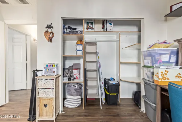 a view of living room with furniture and wooden floor