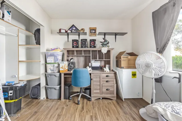 a workspace with furniture and wooden floor