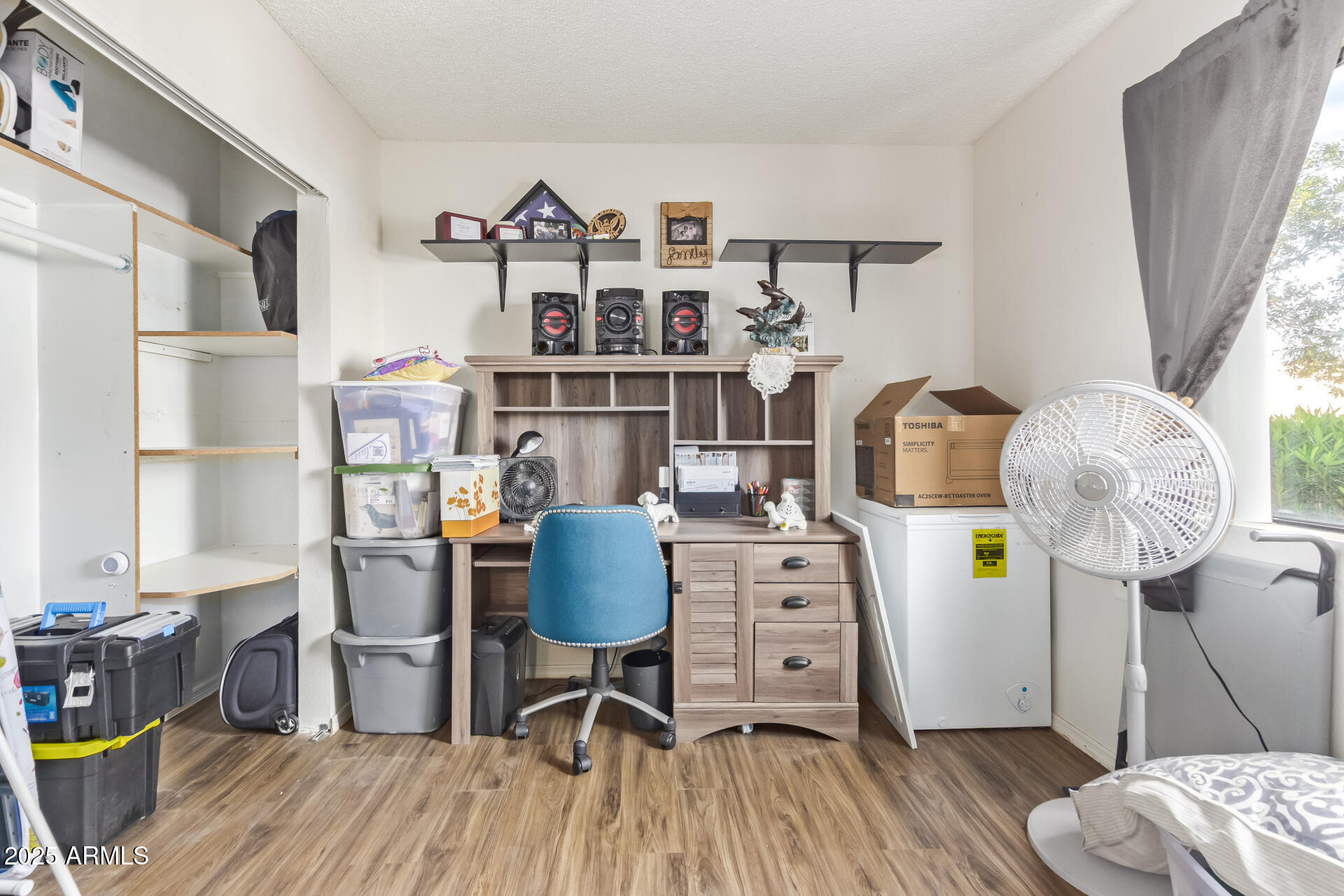 1440 North Idaho Road, Unit 1081 Apache Junction, AZ 85119 - Photo 24 of 33 a workspace with furniture and wooden floor