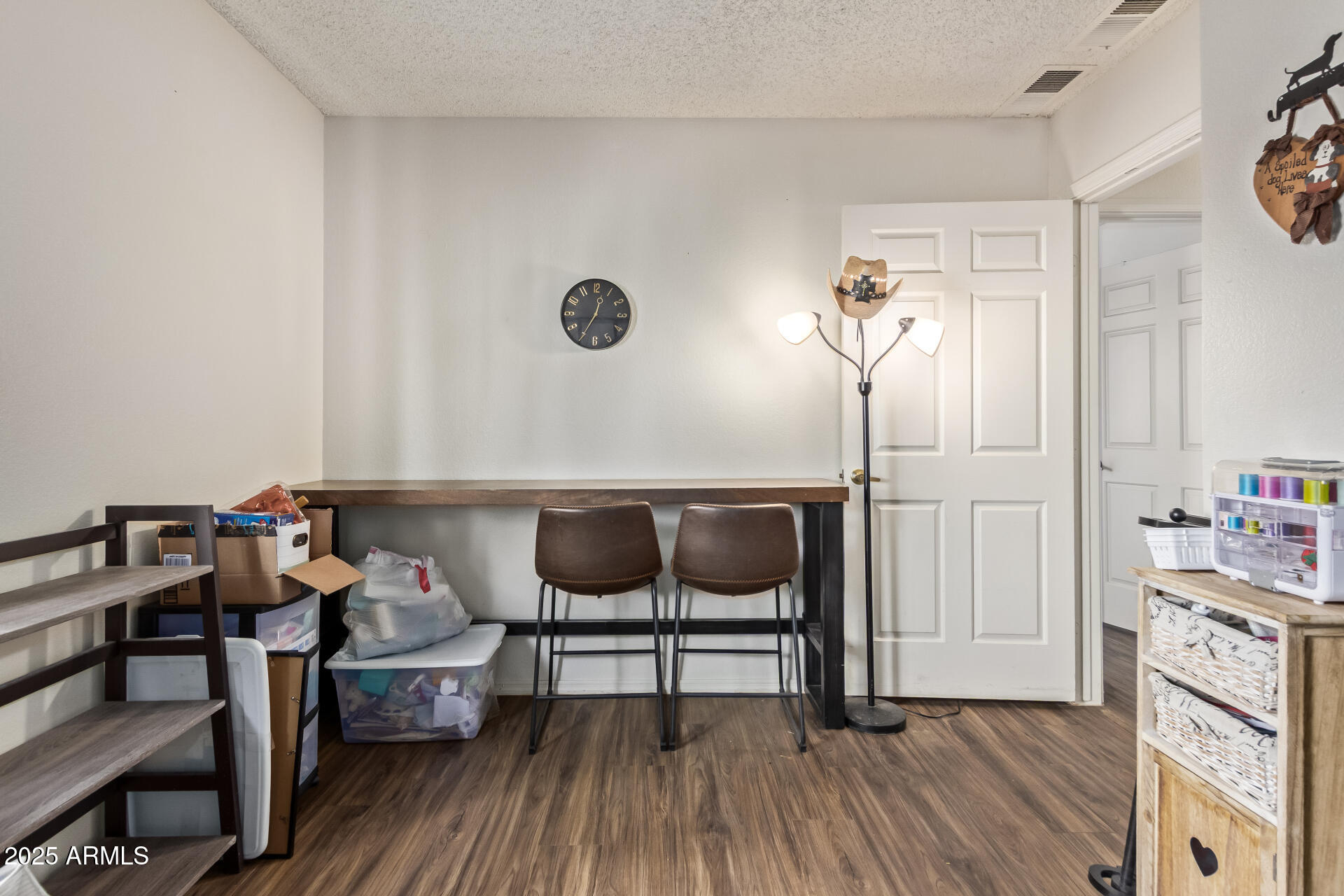1440 North Idaho Road, Unit 1081 Apache Junction, AZ 85119 - Photo 25 of 33 a view of a dining room with furniture and wooden floor