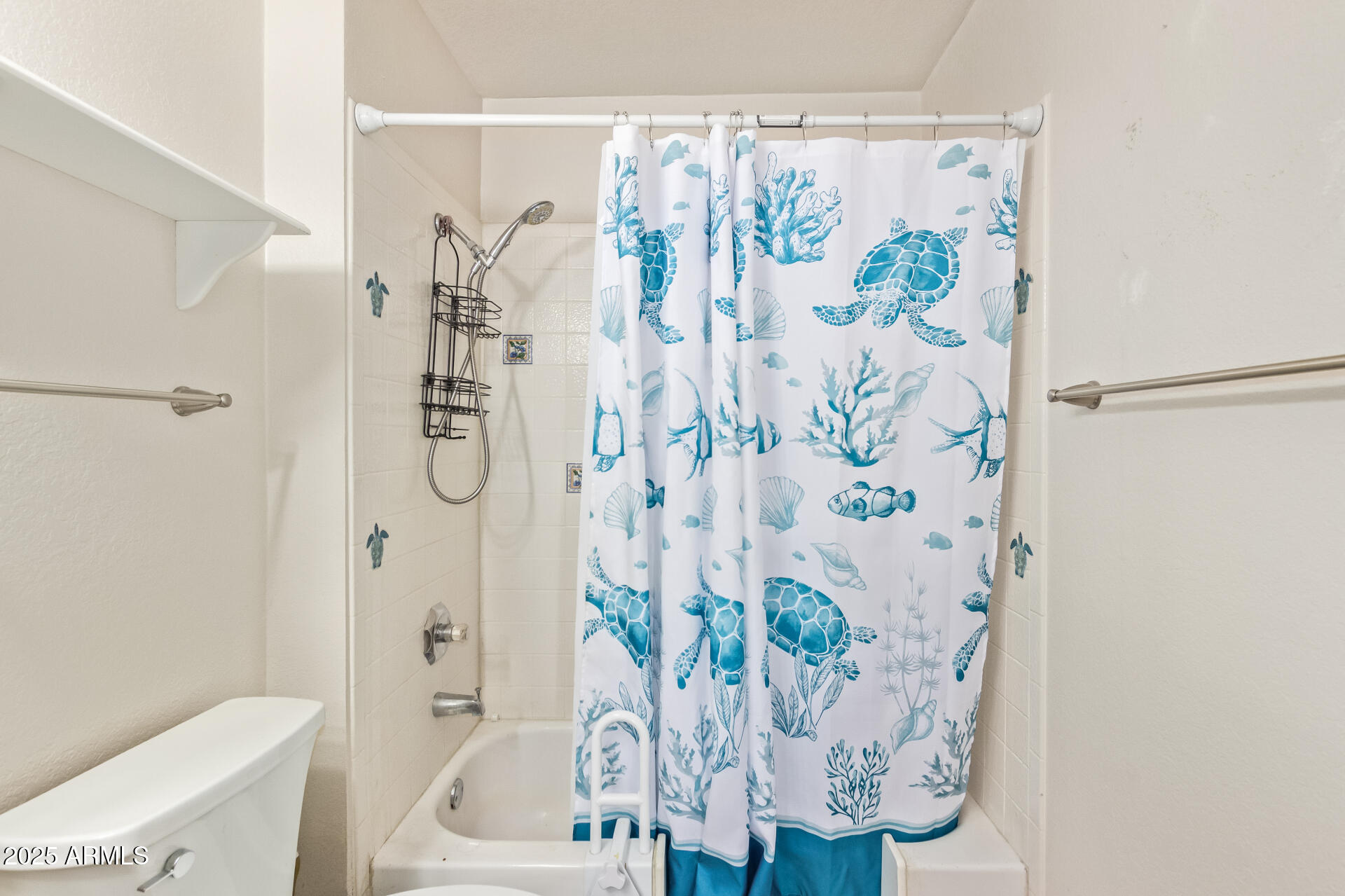 1440 North Idaho Road, Unit 1081 Apache Junction, AZ 85119 - Photo 27 of 33 a bath room with a bathtub and a shower curtain