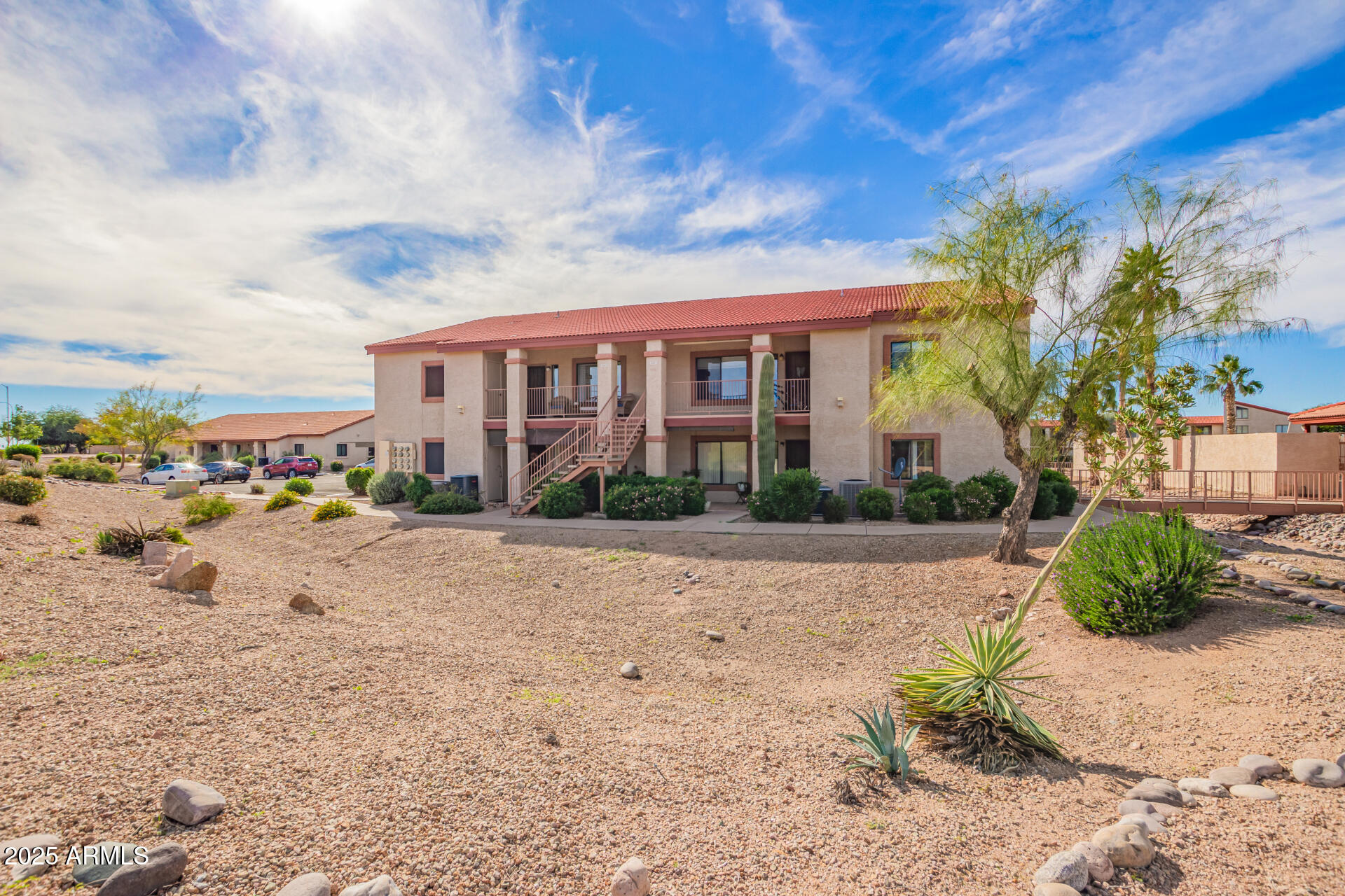 1440 North Idaho Road, Unit 1081 Apache Junction, AZ 85119 - Photo 30 of 33 a view of a house with a yard
