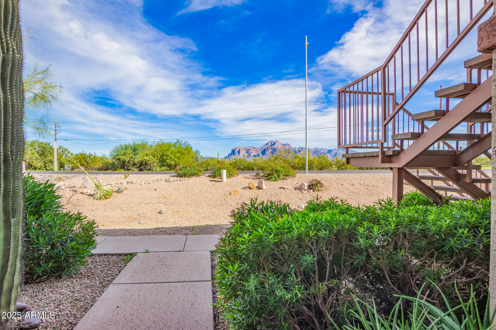 1440 North Idaho Road, Unit 1081 Apache Junction, AZ 85119 - Photo 3 of 33 a view of a swimming pool and an outdoor space