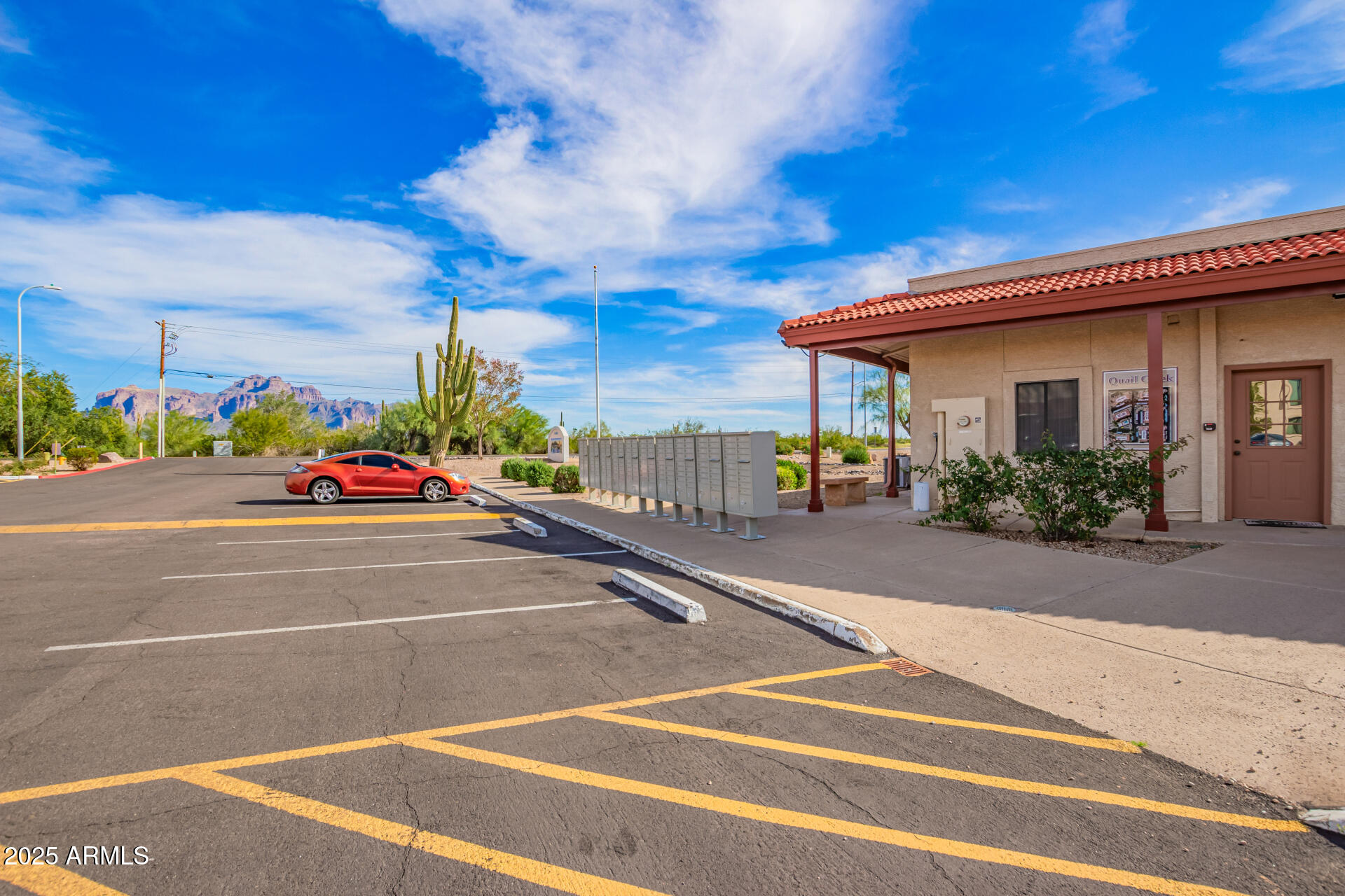 1440 North Idaho Road, Unit 1081 Apache Junction, AZ 85119 - Photo 32 of 33 a cars parked on the side of a street