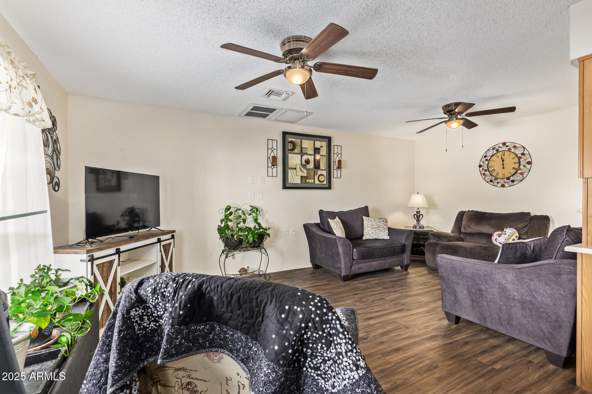 1440 North Idaho Road, Unit 1081 Apache Junction, AZ 85119 - Photo 7 of 33 a living room with furniture and a flat screen tv