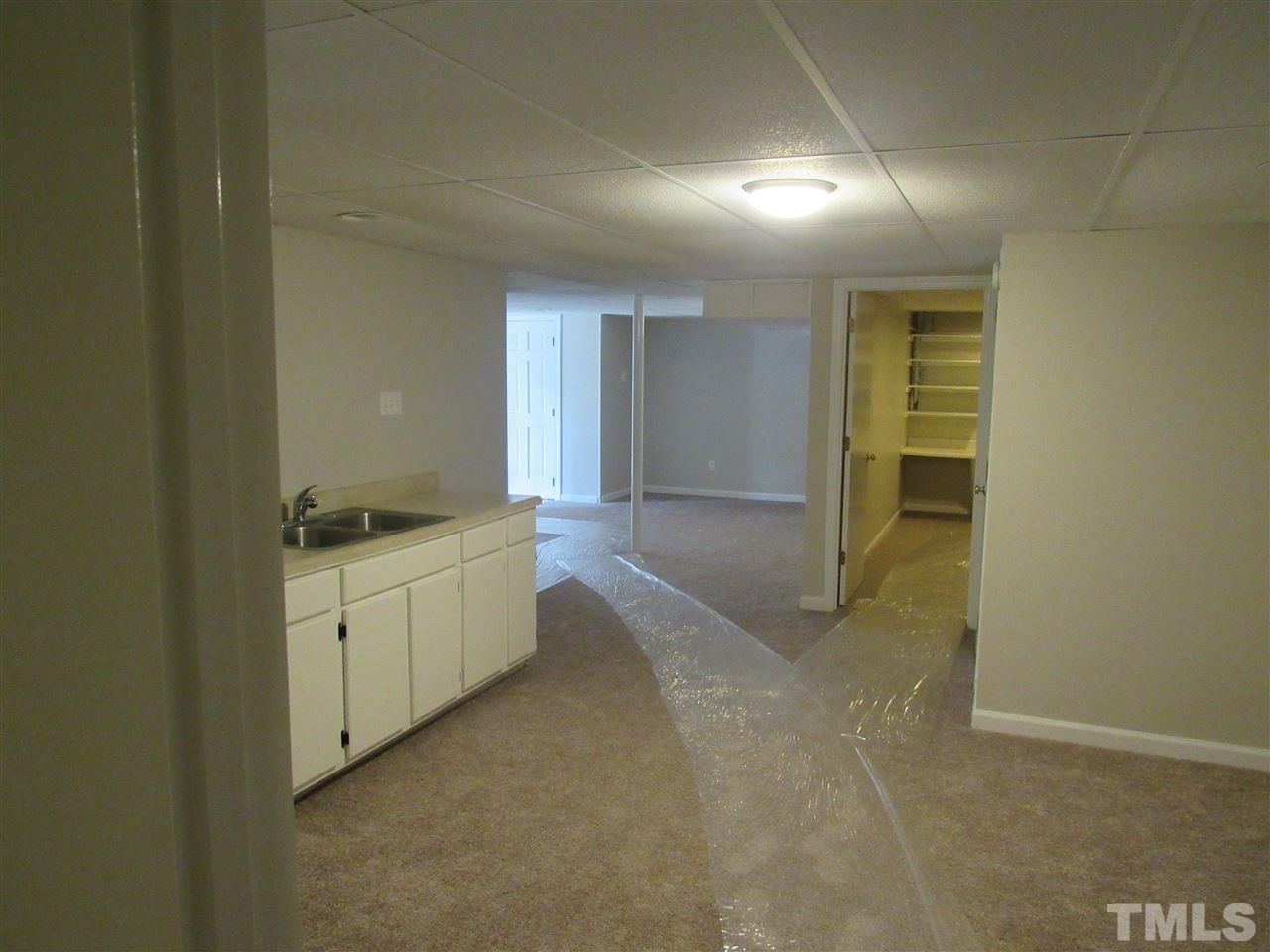7405 Post Oak Road Raleigh, NC 27615 - Photo 11 of 24 Basement has a huge living room area with tons of possibilities!