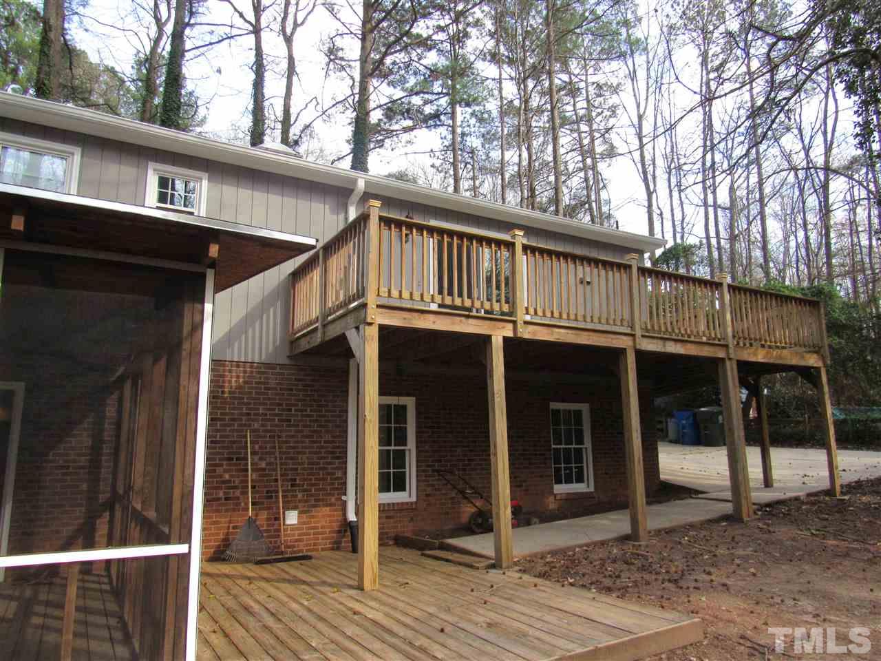 7405 Post Oak Road Raleigh, NC 27615 - Photo 17 of 24 Three outdoor living and entertaining spaces include a huge upper deck, off the kitchen, on the backside of the home, plus an open lower deck adjacent to the huge screened in porch!