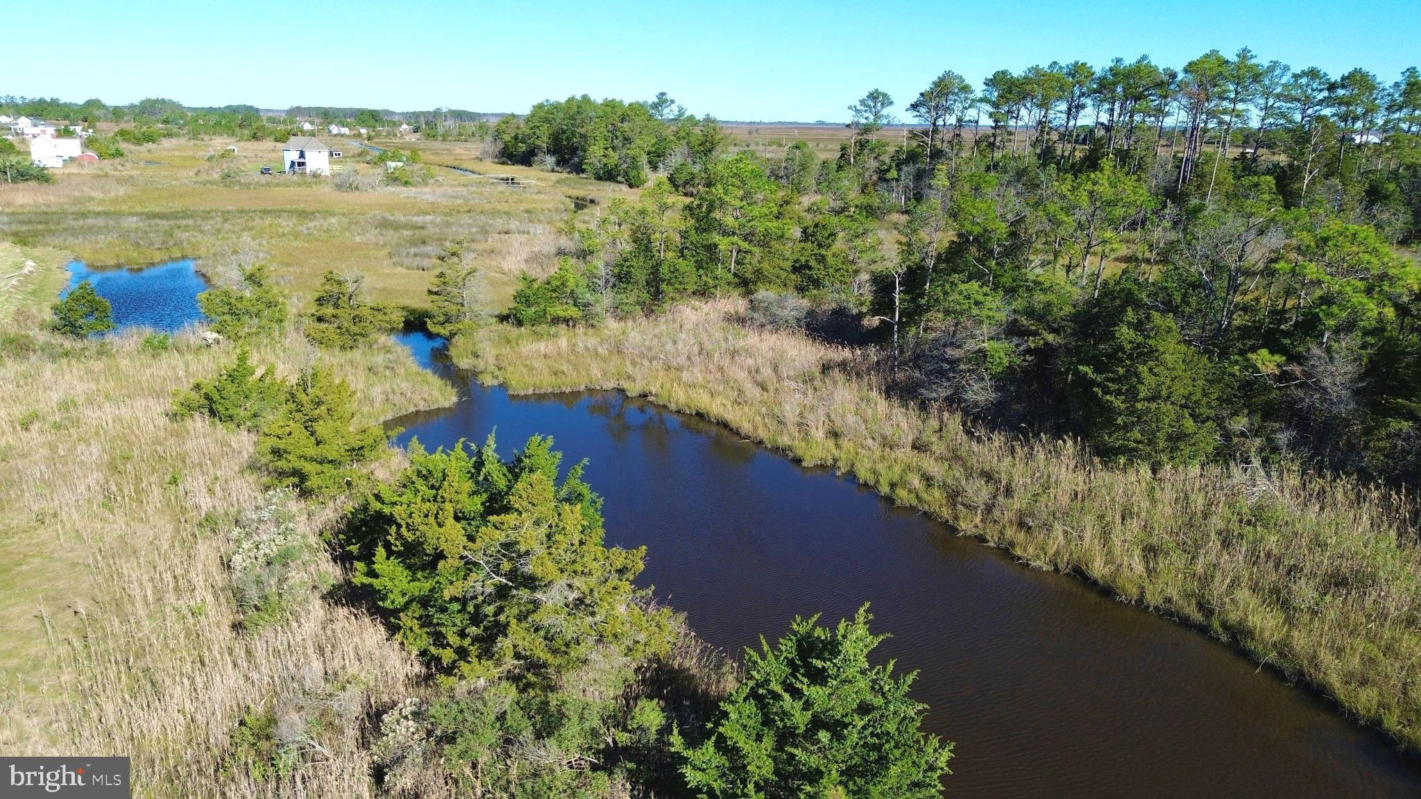 2726 Toddville Road Toddville, MD 21672 - Photo 2 of 14 a view of a lake with a mountain in the background