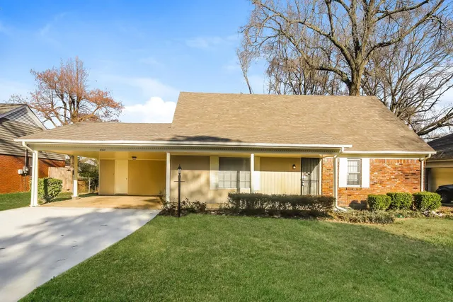 front view of a house with a yard