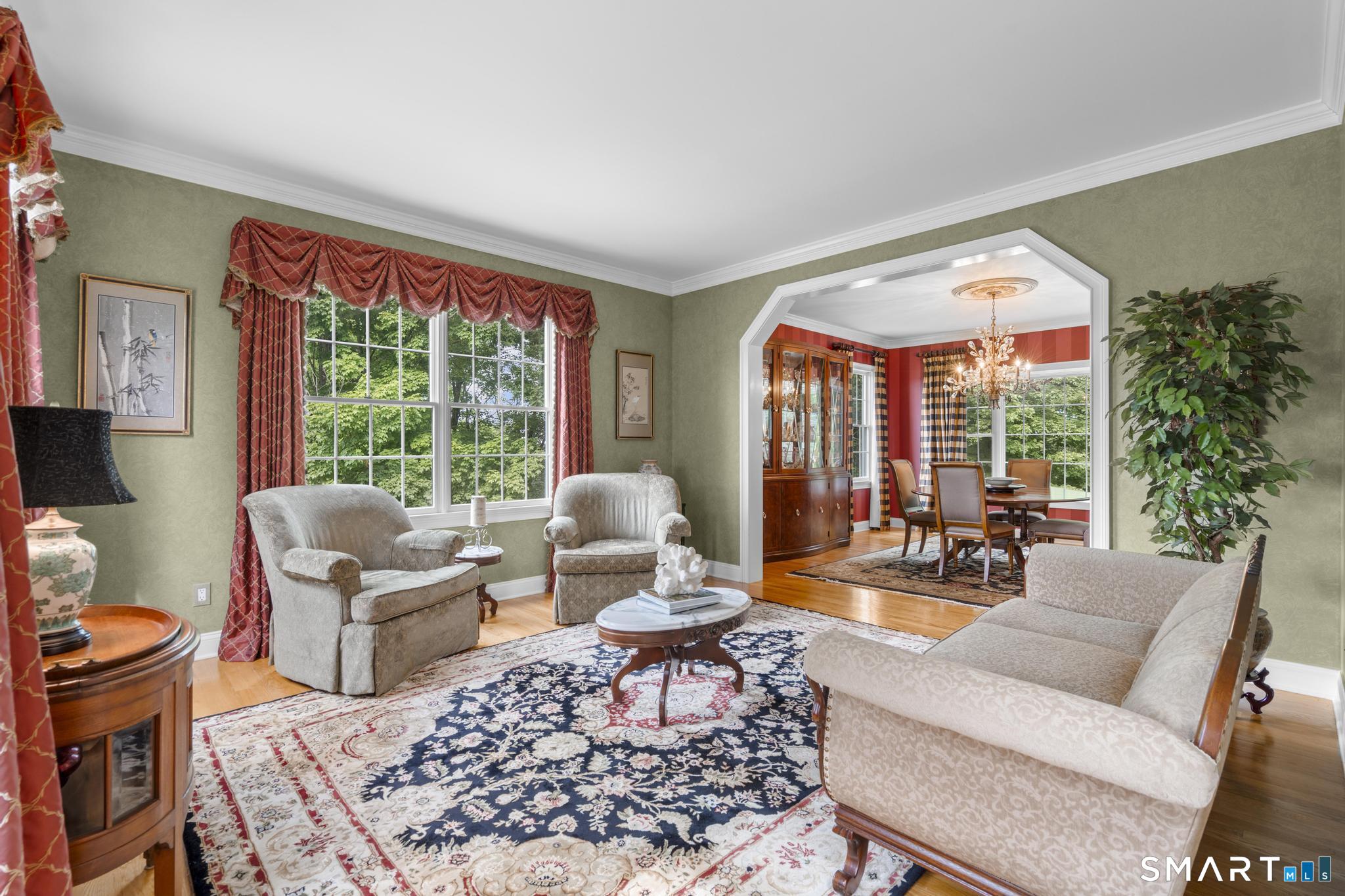12 Logans Way Danbury, CT 06811 - Photo 13 of 40 a living room with furniture large window and a table