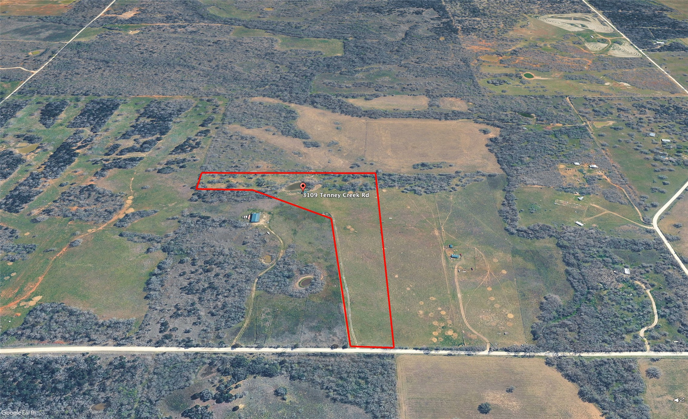 3109 Tenney Creek Road Dale, TX 78616 - Photo 9 of 23 An aerial view showcases a verdant rural lot, presenting an opportunity for development.