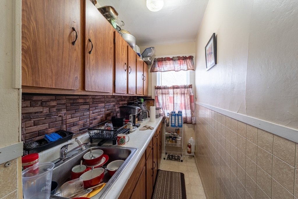 78 Gage Street Worcester, MA 01604 - Photo 16 of 25 a kitchen with lots of appliances and cabinets