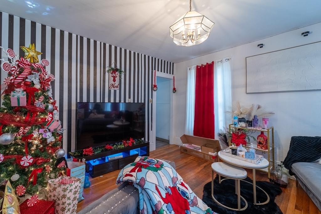 78 Gage Street Worcester, MA 01604 - Photo 5 of 25 a living room with furniture and a flat screen tv
