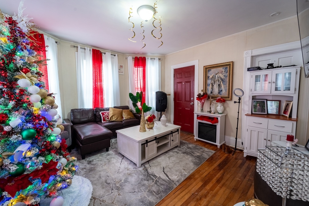 78 Gage Street Worcester, MA 01604 - Photo 6 of 25 a living room with furniture and flowers