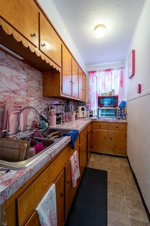 78 Gage Street Worcester, MA 01604 - Photo 10 of 25 a kitchen with lots of appliances and cabinets
