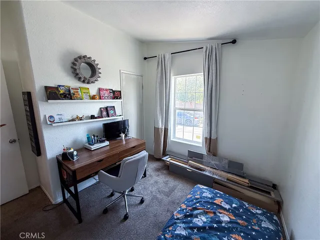 a workspace with furniture and a window