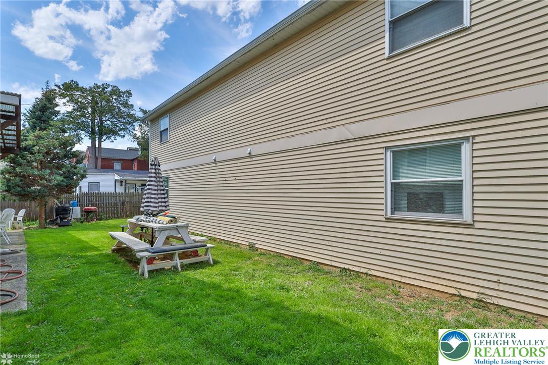 802 West Berwick Street Easton, PA 18042 - Photo 49 of 54 a white and green house with a yard