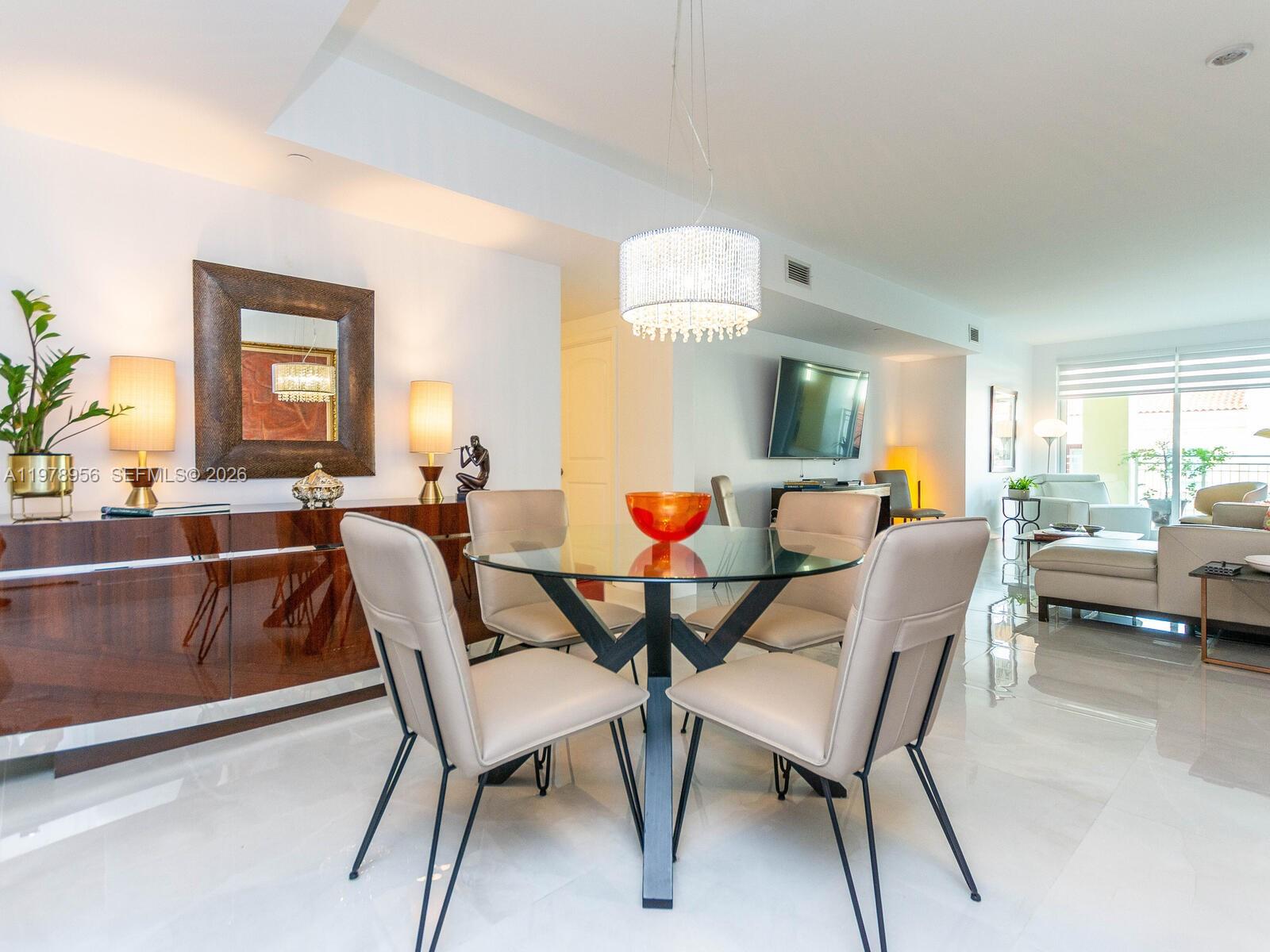 7350 Southwest 89th Street, Unit 719S Miami, FL 33156 - Photo 7 of 30 a view of a dining room with furniture and a large window