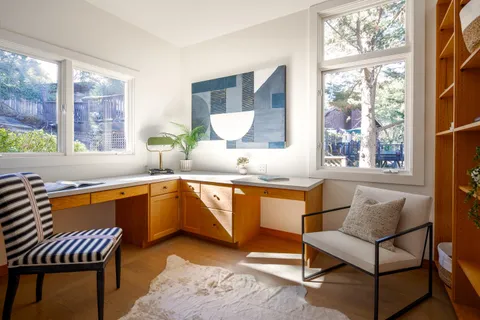 a kitchen with a table chairs and a sink