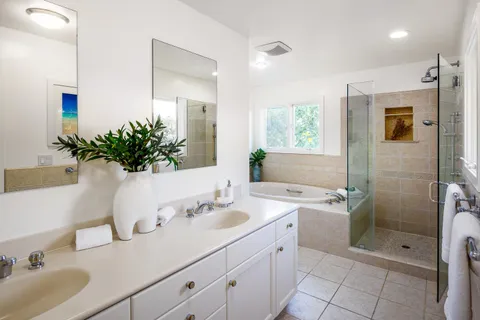 a bathroom with a sink double vanity and a mirror