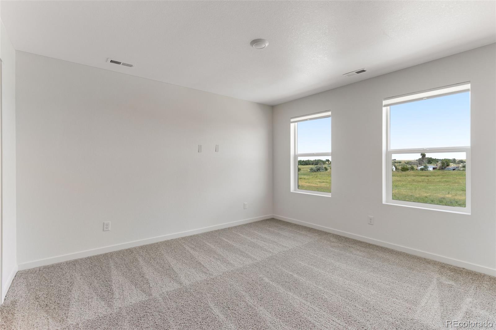 2356 Merlot Street Fort Lupton, CO 80621 - Photo 14 of 24 a view of an empty room with a window