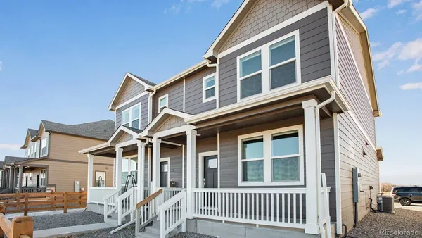 a front view of a house with a porch