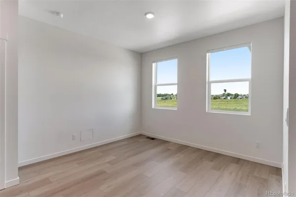 an empty room with windows