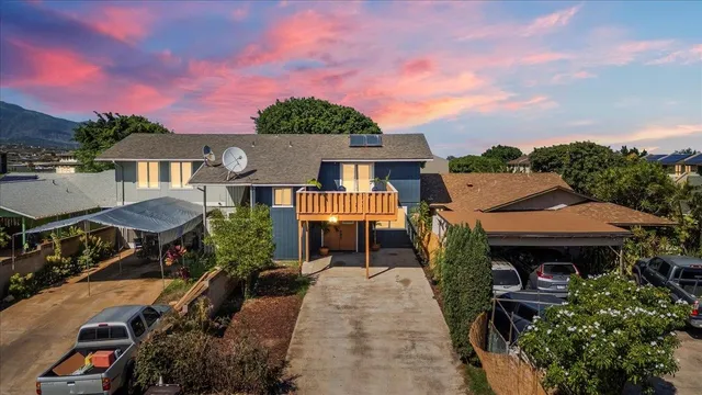 an aerial view of a house with a garden