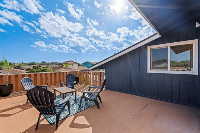 a view of a balcony with furniture